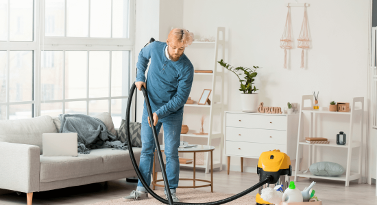 young-man-hoovering-carpet-home 3 young-man-hoovering-carpet-home 3